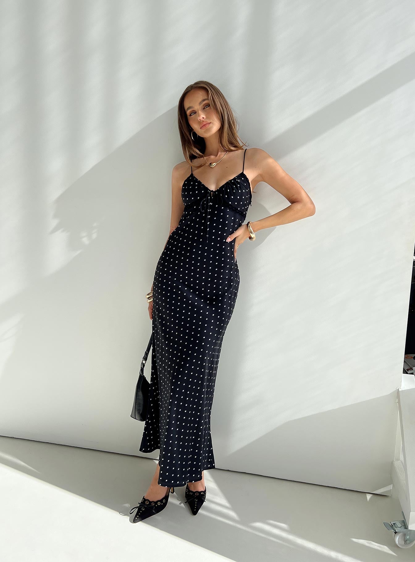 front view of model wearing Princess Polly Emily Maxi Dress Black Polka Dot V-Neck 