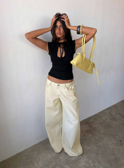 Showcasing the Ramos Low Rise Wide Leg Jeans Cream in womens jeans with low-rise waist front view of model wearing Princess Polly