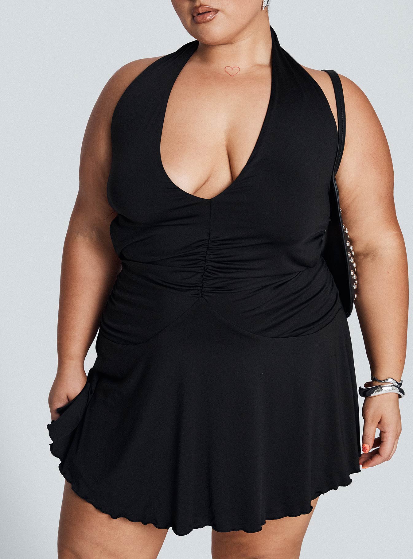 front view of model wearing Princess Polly Maeva Halter Mini Dress Black Curve Plunger 