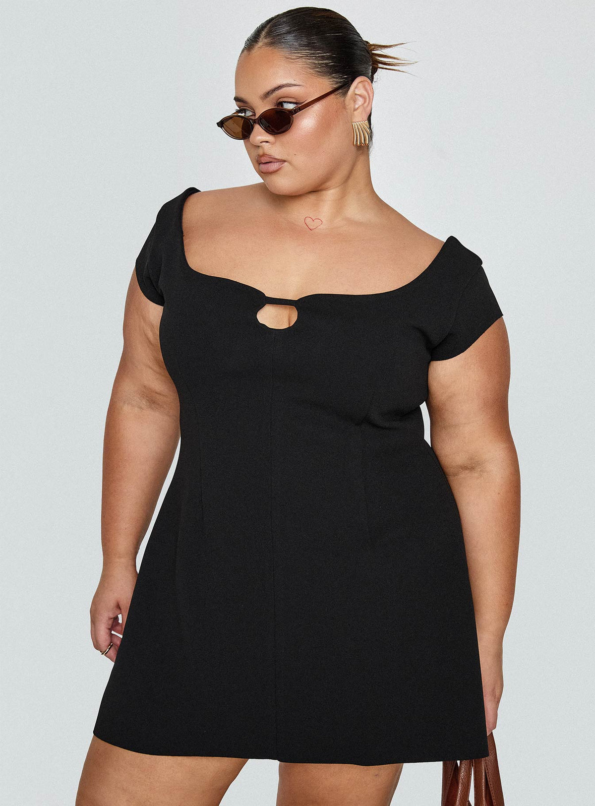 side view of model wearing Princess Polly Sylvette Mini Dress Black Curve Scoop Neck 