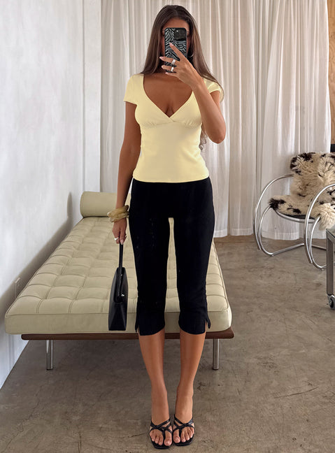 front view of model wearing Princess Polly Baseline Rib Capri Pants Black Tall Mid Rise Pants 