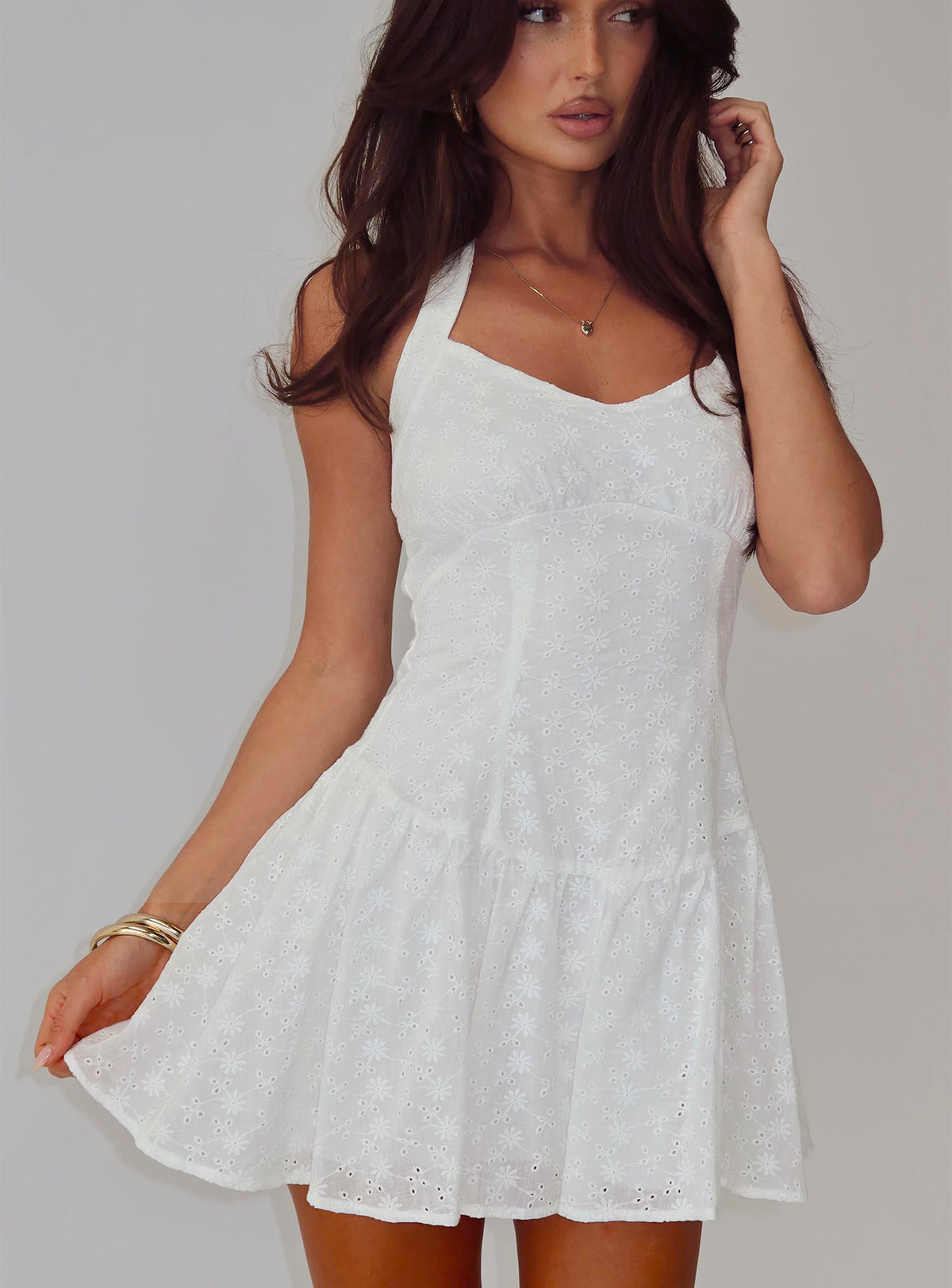 side view of model wearing Princess Polly Kaesie Halter Mini Dress White V-Neck 