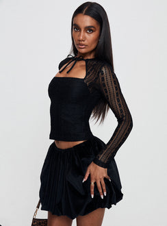 side view of model wearing Princess Polly Worth My Time Tie Neck Cut Out Top Black Full Sleeves High Neck 