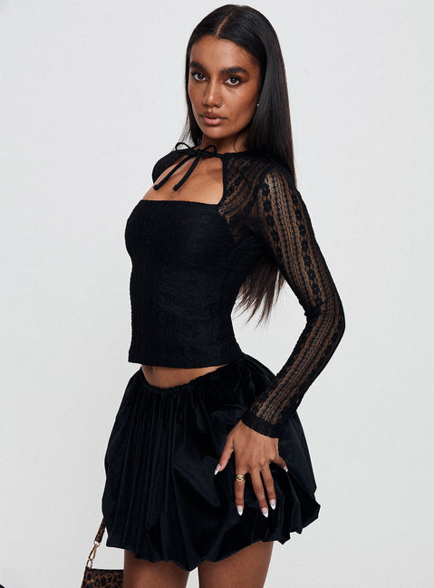 side view of model wearing Princess Polly Worth My Time Tie Neck Cut Out Top Black Full Sleeves High Neck 