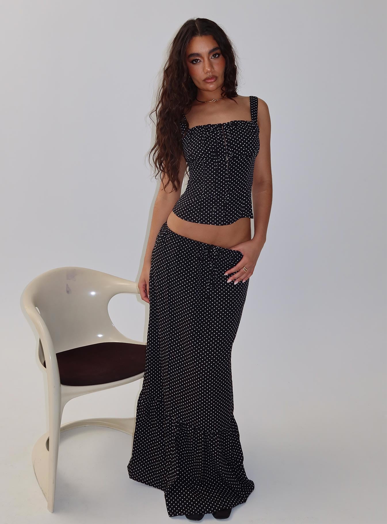   side view of model wearing Princess Polly Modern Girl Maxi Skirt Black / Polka Dot Skirts 