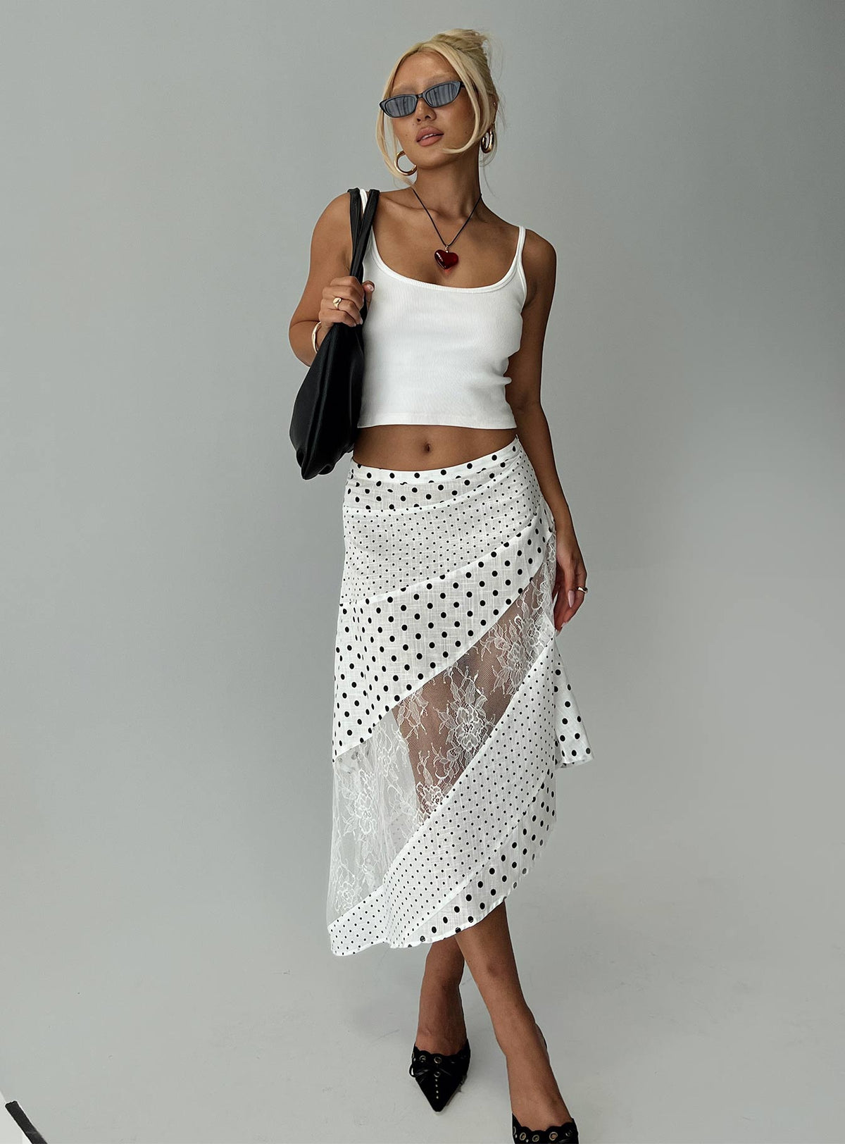   side view of model wearing Princess Polly Rennar Maxi Skirt White / Polka Dot Petite Midi Skirts 