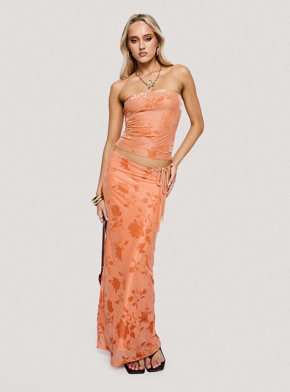 side view of model wearing Princess Polly Mikah Strapless Top Orange Sleeveless straight 