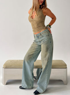 Featuring the Top Model Jean Stone Blue womens-jeans with high-rise design side view of model wearing Princess Polly