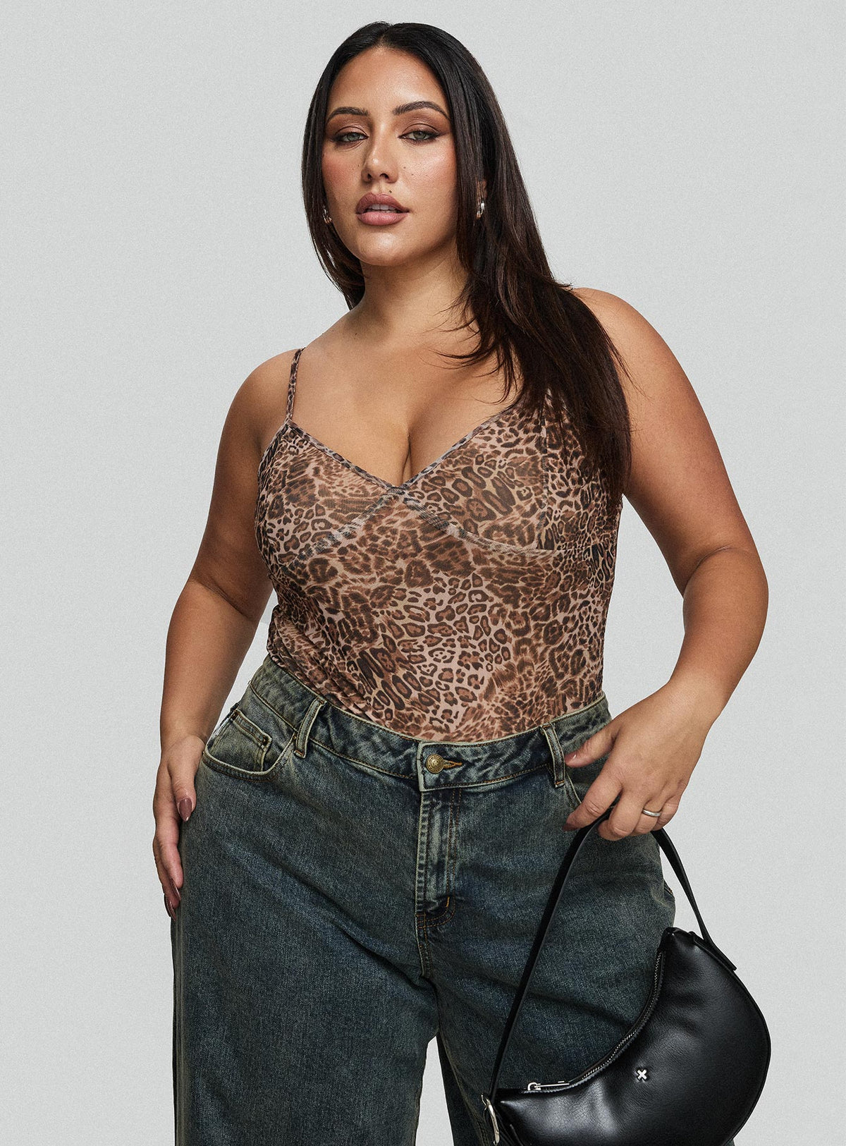 side view of model wearing Princess Polly Elixia Bodysuit Leopard Curve Sleeveless 