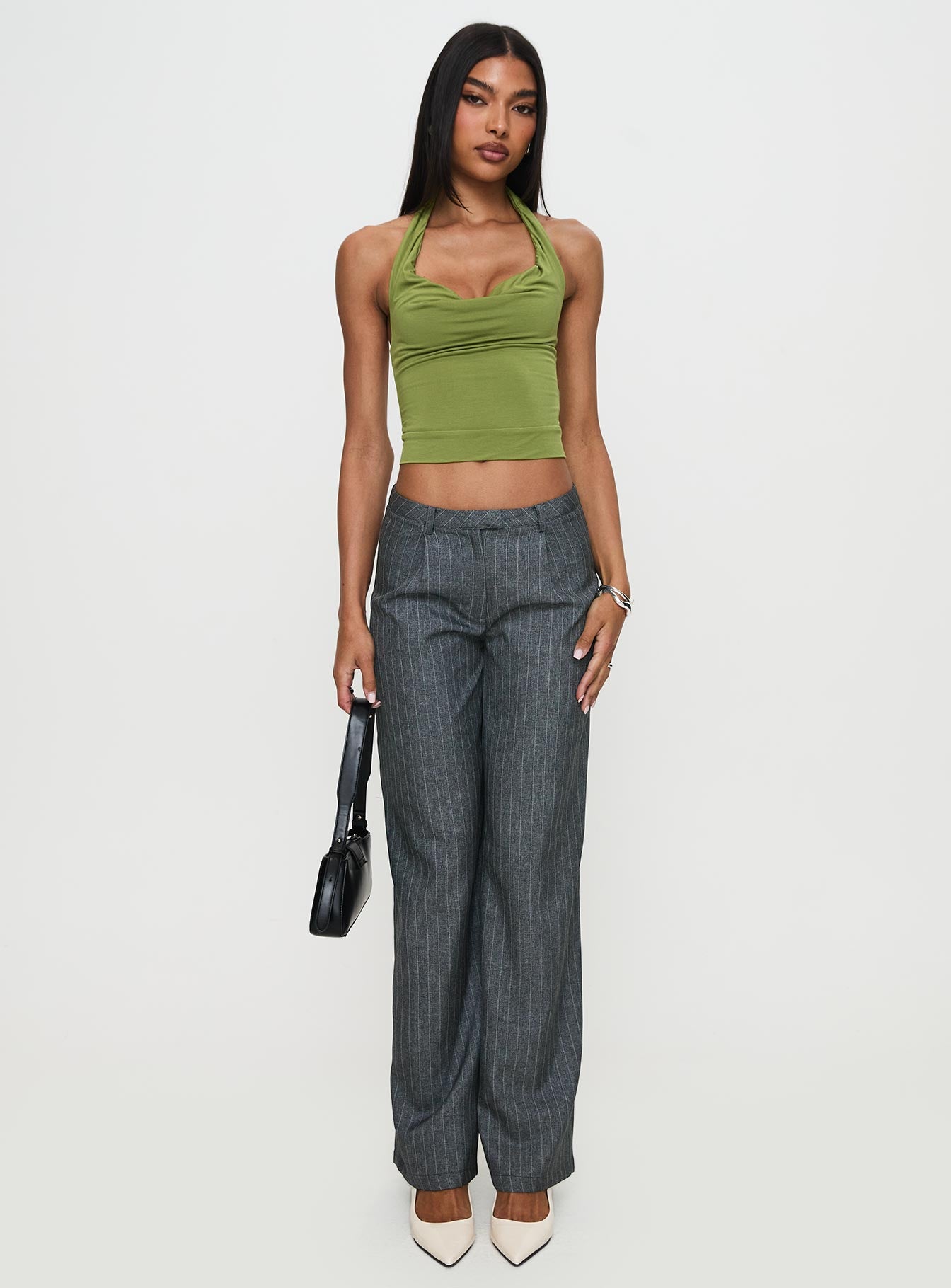 side view of model wearing Princess Polly Irina Multi-wear Top Green Sleeveless Asymmetric Neckline 