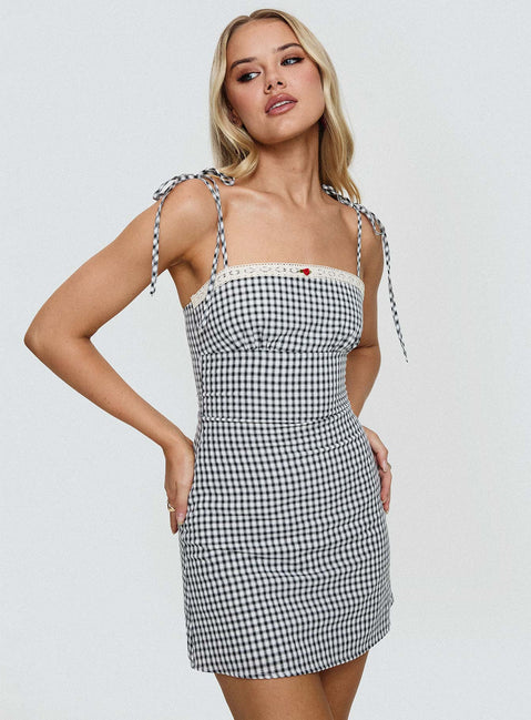 front view of model wearing Princess Polly Burkes Mini Dress Black Check Square Neck 