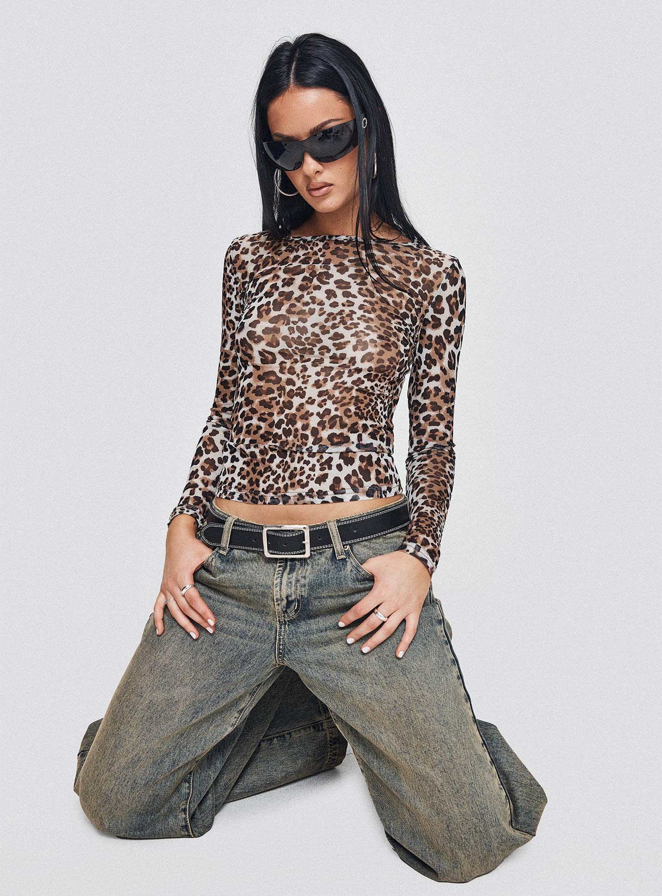 side view of model wearing Princess Polly Believe Me Long Sleeve Top Leopard Full Sleeves Scoop Neck 