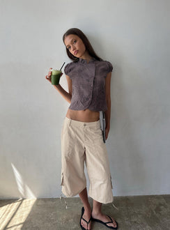 Featuring the Relaxer 3/4 Cargo Pants Beige in womens regular pants with mid-rise front view of model wearing Princess Polly