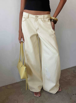 Showcasing the Ramos Low Rise Wide Leg Jeans Cream in womens jeans with low-rise waist front view of model wearing Princess Polly