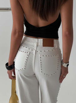 Displaying the Saving Up Mid Rise Straight Leg Studded Jeans White in womens-jeans with silver studded pockets and belt back view of model wearing Princess Polly