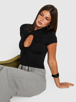 Featuring the Maeci Ruched Tie Detail Bodysuit Black womens-bodysuit with short sleeves and high-neck keyhole neckline side view of model wearing Princess Polly