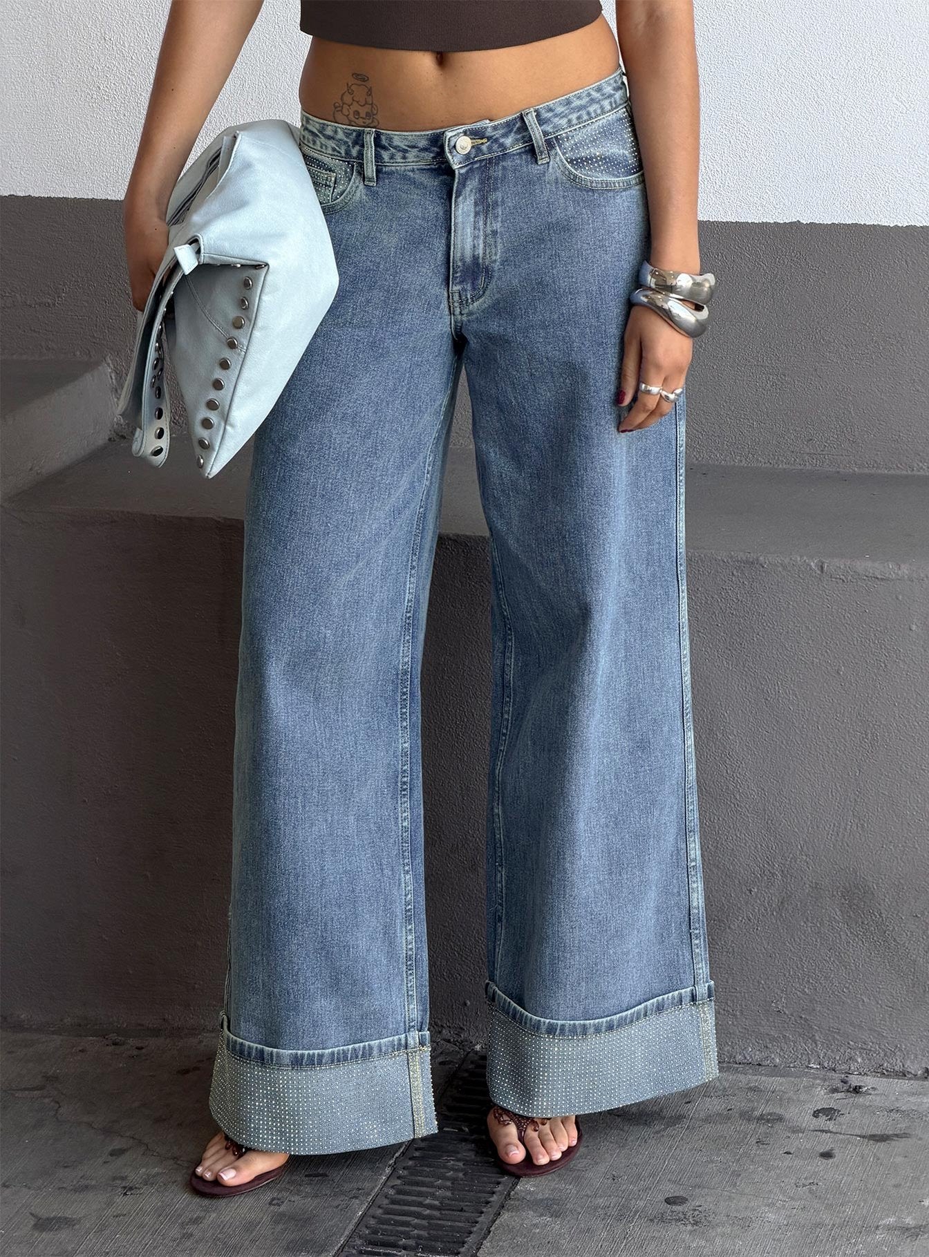 side view of model wearing Princess Polly Ramos Diamante Low Rise Wide Leg Jeans Washed Mid Blue Low Rise Jeans 