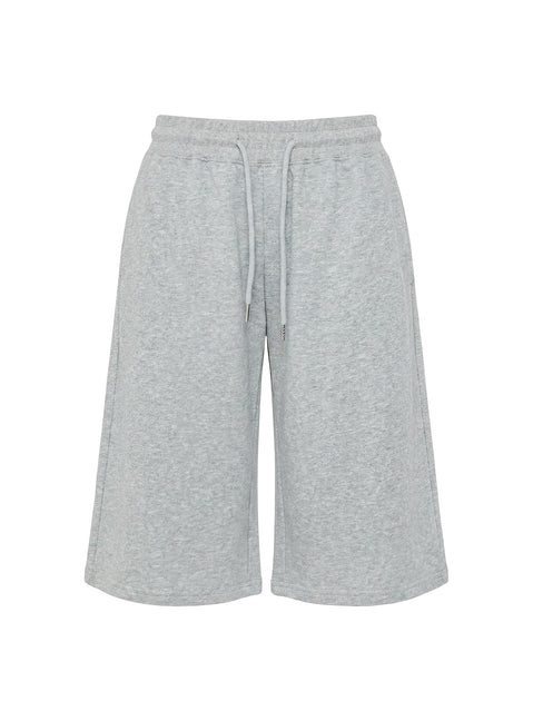 Highlighting the drawstring detail of the Nikko Longline Fleece Shorts Grey Marle in womens regular pants with mid-rise Princess Polly