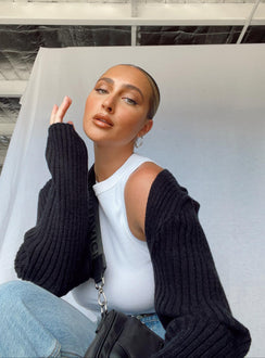 Introducing the Aytan Bolero Sweater in Black, a short jumper with cold shoulder detailing, front view of model wearing Princess Polly