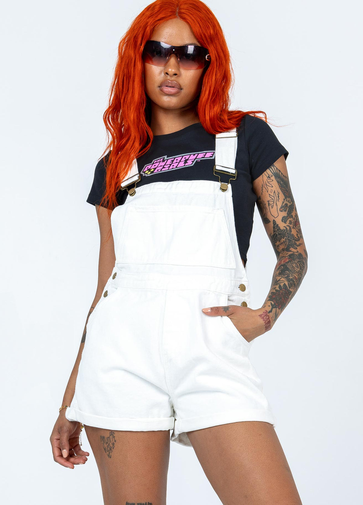 Overalls Adjustable shoulder straps  Button fastening at sides Large chest pockets Front & back pockets  Fixed rolled hem Adjustable straps Non-stretch 