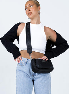 Introducing the Aytan Bolero Sweater in Black, a short jumper with cold shoulder detailing, front view of model wearing Princess Polly