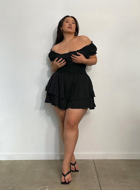 Black romper Can be worn on or off the shoulder Soft textured material Shirred waistband Ruffle detailing