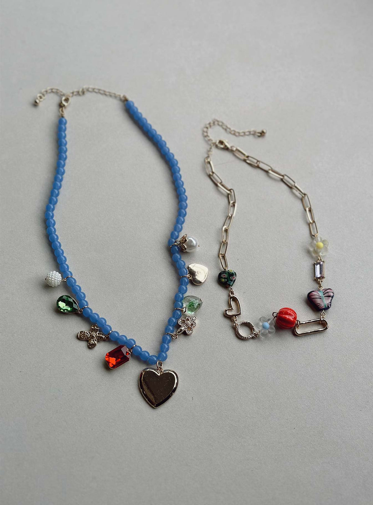 Necklace pack Pack of two Beaded design Drop charm details Lobster clasp fastening Gold-toned
