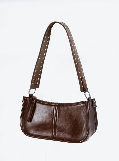 Dark brown bag Faux leather material Zip fastening Adjustable & removable cross-body strap Removable fixed shoulder strap Internal pocket Silver toned hardware Flat base