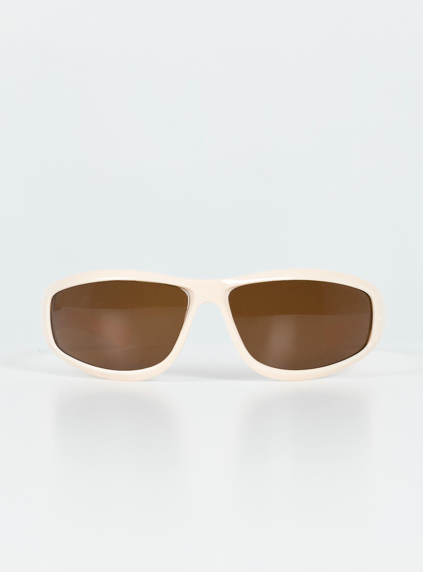Sunglasses Wrap around design Light weight frame Brown tinted lenses Moulded nose bridge