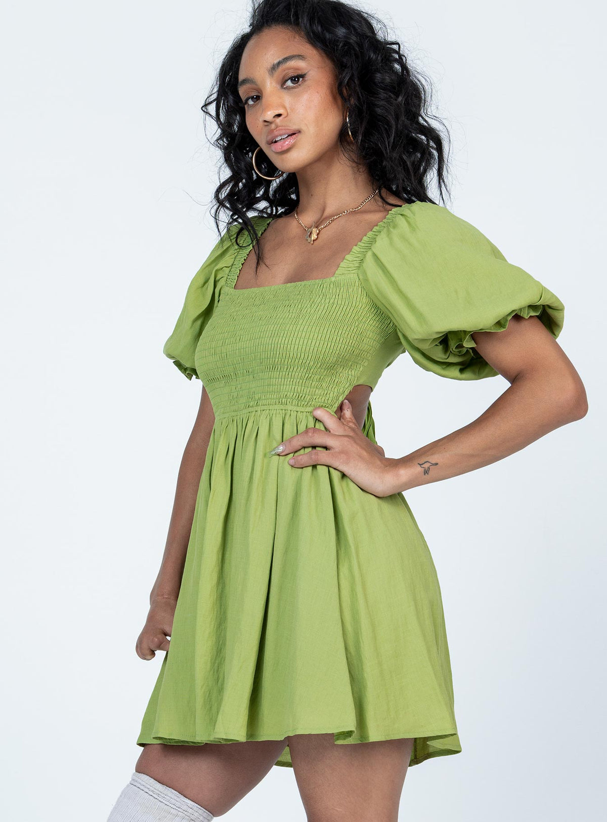 side view of model wearing Princess Polly Dani Mini Dress Green Square Neck 