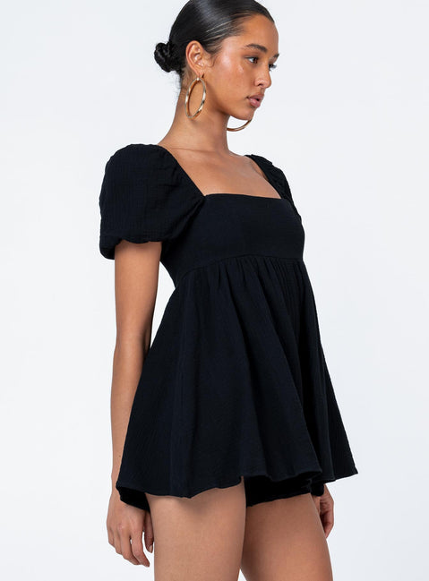 Black romper Muslin look material Square neckline Elasticated puff sleeves Shirred back panel Invisible zip fastening at back Relaxed leg