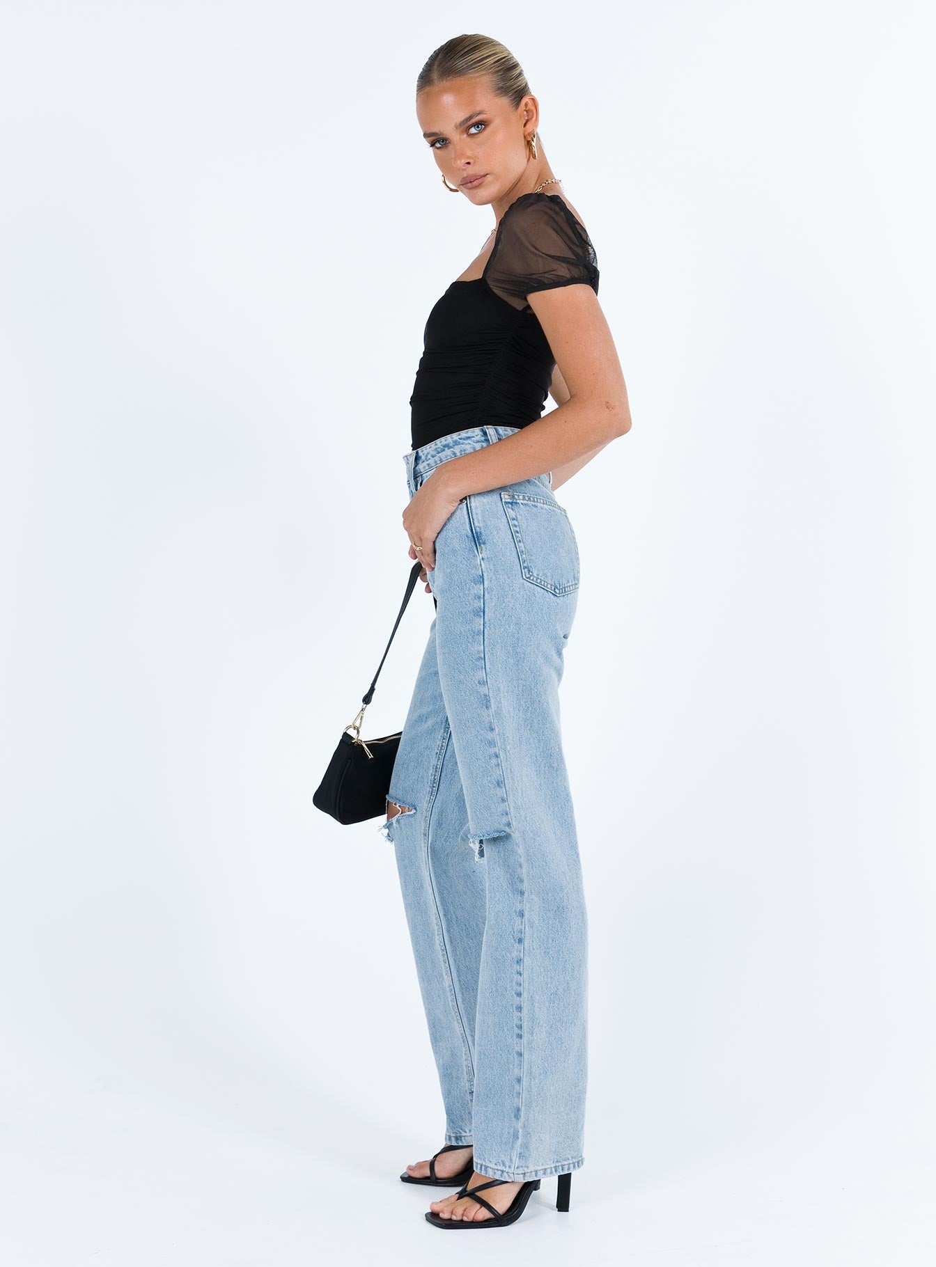 side view of model wearing Princess Polly Dostan Bodysuit Black Short Sleeve Bodysuit 