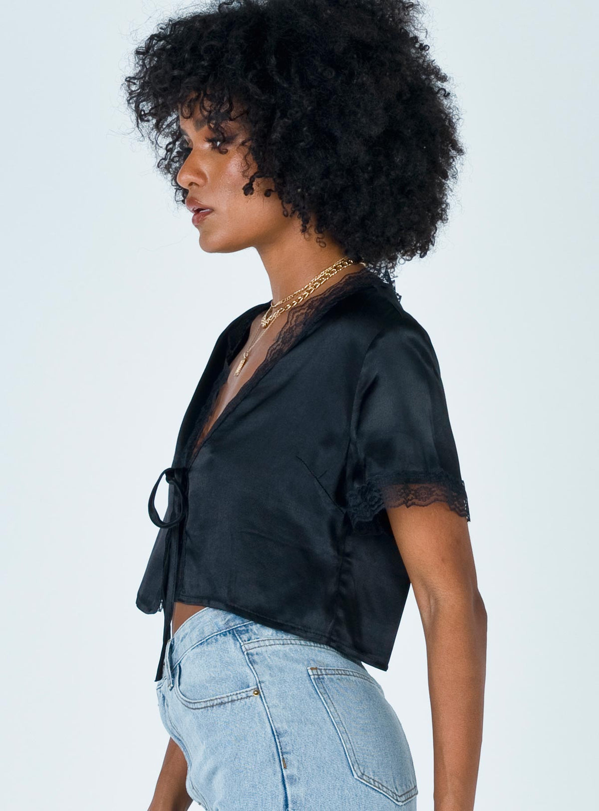 side view of model wearing Princess Polly Vintage Tie Up Top Black 