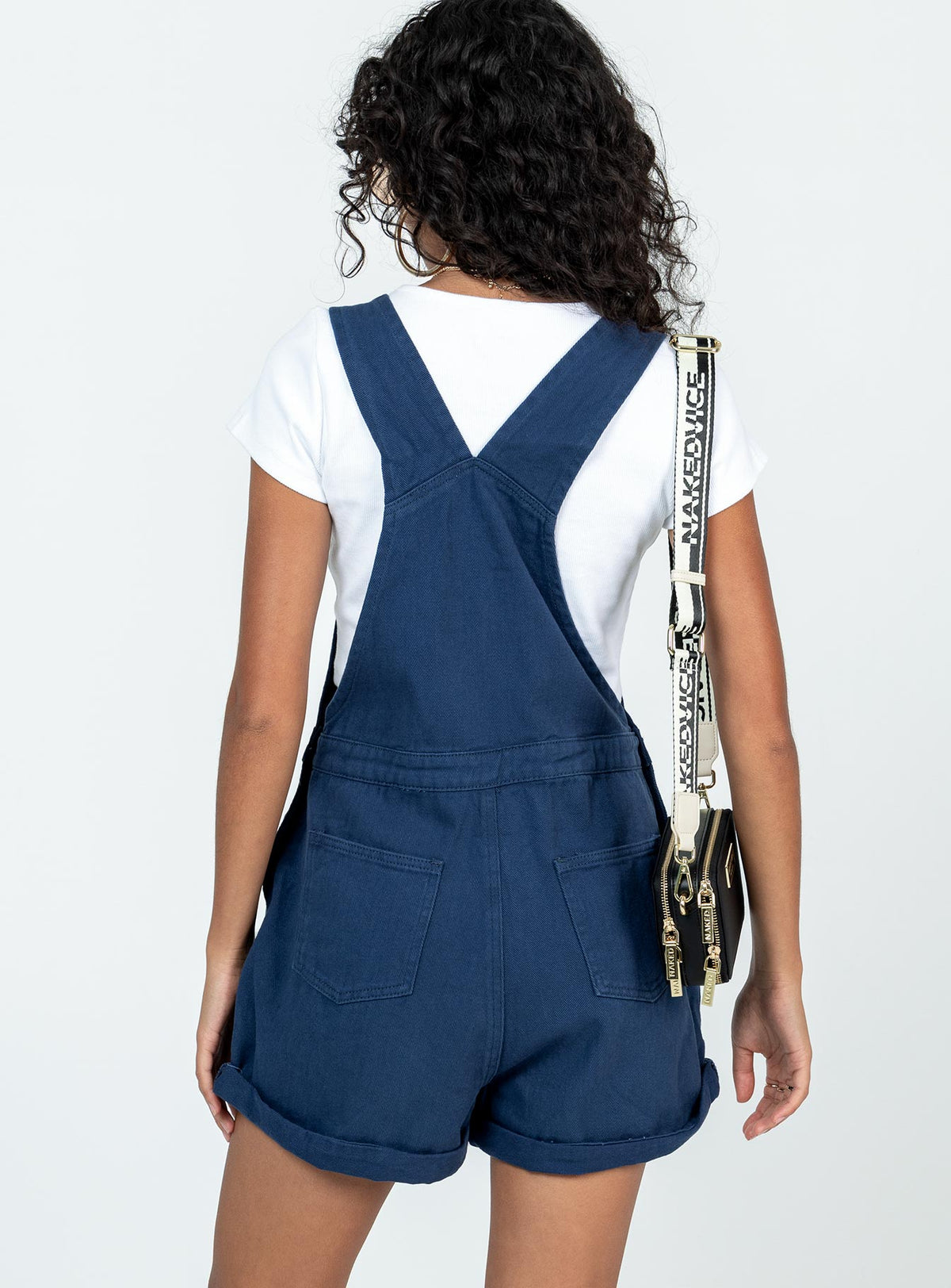 Overalls Denim material Adjustable buckle straps Button fastening at sides Large chest pocket Classic four pockets  Gold-toned hardware  Fixed rolled hem