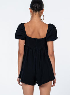 Black romper Muslin look material Square neckline Elasticated puff sleeves Shirred back panel Invisible zip fastening at back Relaxed leg
