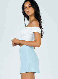   side view of model wearing Princess Polly Selby Mini Skirt Blue 