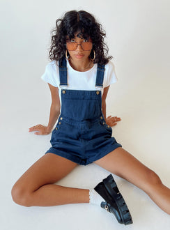 Overalls Denim material Adjustable buckle straps Button fastening at sides Large chest pocket Classic four pockets  Gold-toned hardware  Fixed rolled hem