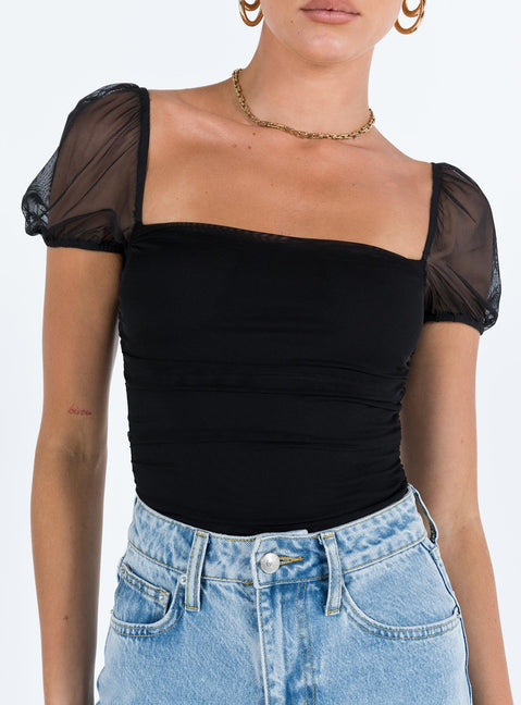 front view of model wearing Princess Polly Dostan Bodysuit Black Short Sleeve Bodysuit 