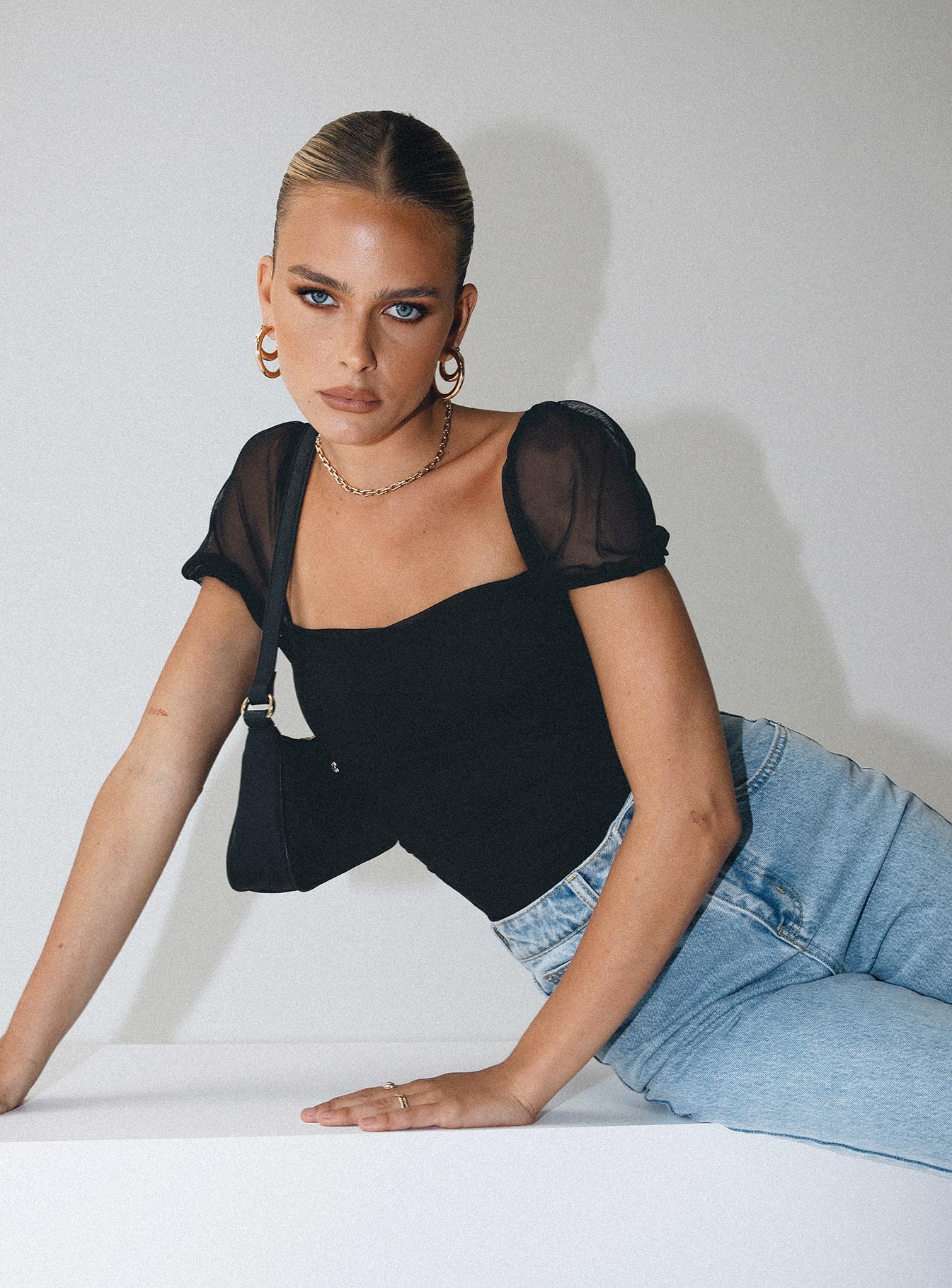 front view of model wearing Princess Polly Dostan Bodysuit Black Short Sleeve Bodysuit 